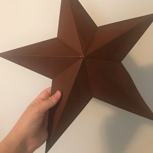 Metal decorative star with rust colour finish